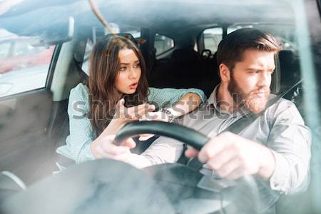 Couple riding in car together Stock photo © deandrobot