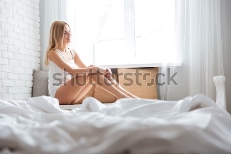 Woman undressing at home Stock photo © deandrobot