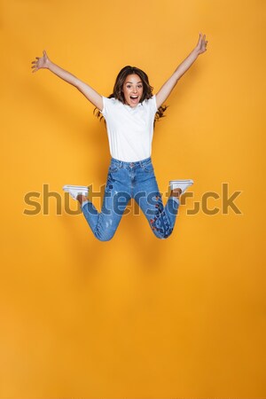 Cheerful afro american man jumping  Stock photo © deandrobot