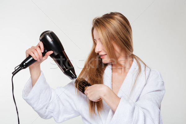 Woman drying her hair  Stock photo © deandrobot