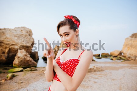 Beautiful seductive pin up girl eating cream cake Stock photo © deandrobot