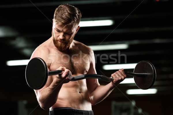 Concentrado deportes hombre deporte barra con pesas Foto stock © deandrobot