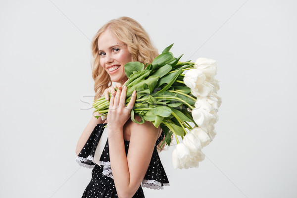 Lächelnd blonde Frau posiert Bouquet Blumen Kleid Stock foto © deandrobot