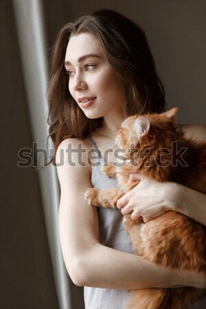 Mystery woman sitting on bed Stock photo © deandrobot