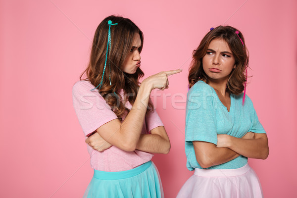 Close-up portrait of offended brunette woman pointing with finge Stock photo © deandrobot