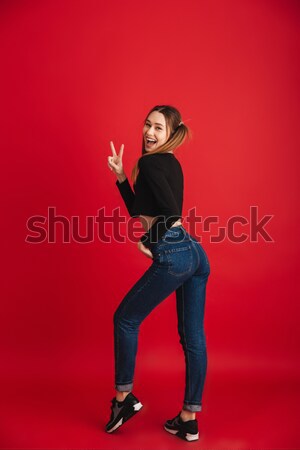 Stock photo: Full length image of cheerful punk couple dancing together