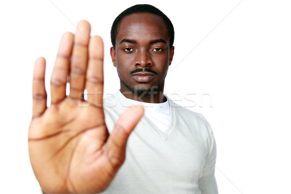 年輕 非洲的 男子 顯示 停止簽署 手 商業照片 © deandrobot