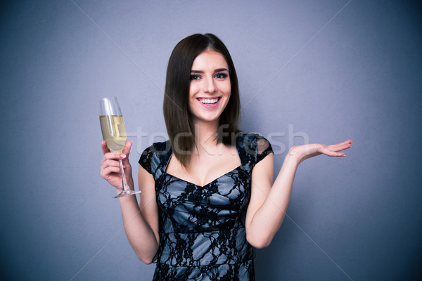 Sonriendo mujer bonita vidrio champán gris Foto stock © deandrobot
