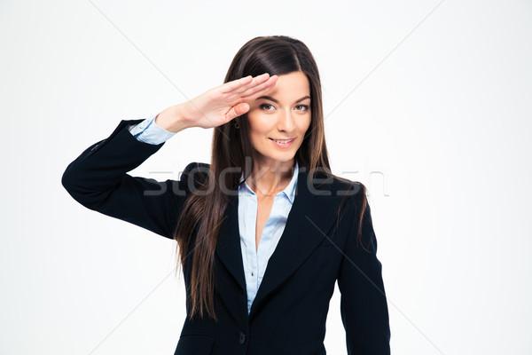 Happy attractive businesswoman saluting Stock photo © deandrobot