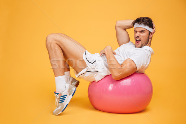 Fitness balle orange jeunes élégant [[stock_photo]] © deandrobot