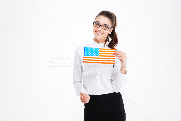 Cheerful attractive young businesswoman in glasses holding USA flag Stock photo © deandrobot