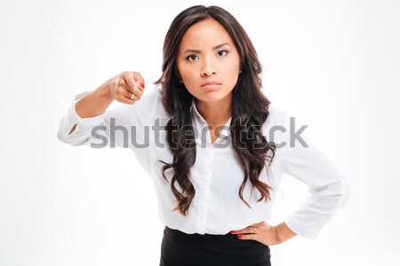 Portrait of a serious asian businessoman pointing finger at camera Stock photo © deandrobot