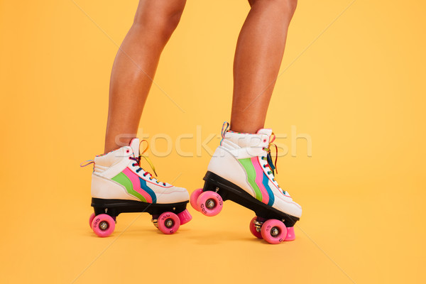 Cropped image of women legs wearing colorgul rollers Stock photo © deandrobot