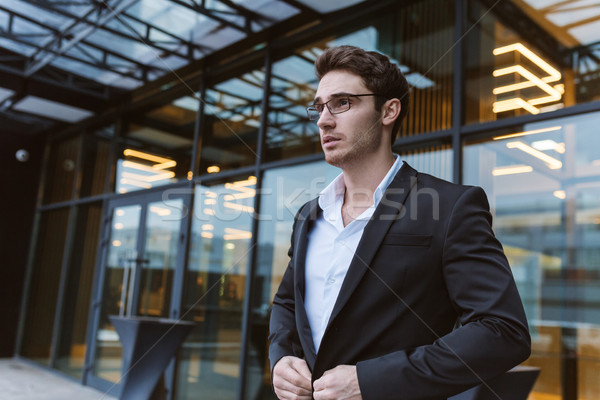 Business man in glasses near the office Stock photo © deandrobot
