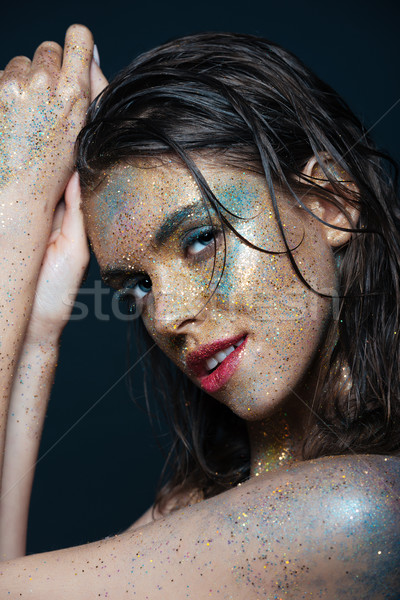 Beauty portrait of happy charming young woman with shimmering makeup Stock photo © deandrobot