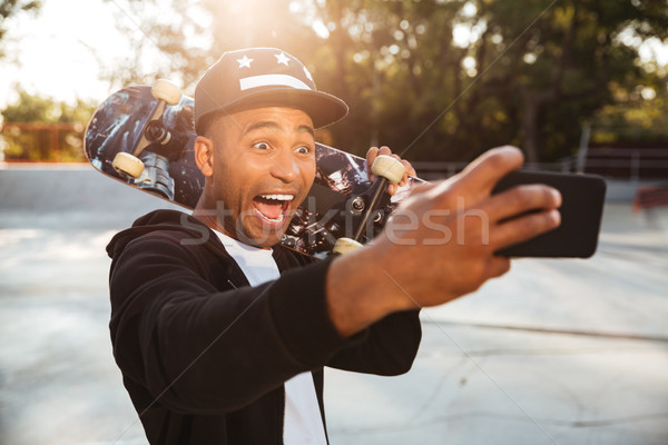 Stock photo: Portrait of an excited funny african male teenager