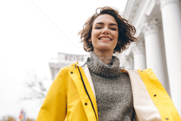 Closeup portrait of charming young woman with bob haircut enjoyi Stock photo © deandrobot