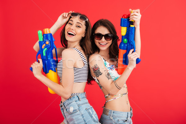 Portrait of two smiling girls in summer clothes Stock photo © deandrobot