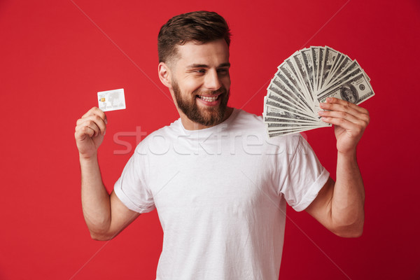 Excitado joven dinero tarjeta de crédito imagen Foto stock © deandrobot