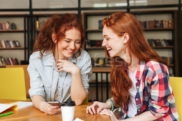 Portrait of a two smiling teenage girls Stock photo © deandrobot