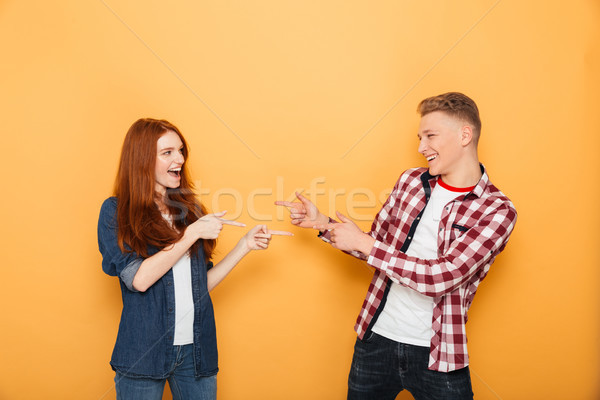 Portrait of a happy teenage couple Stock photo © deandrobot