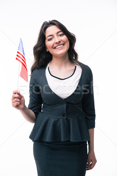 Smiling businesswoman holding US flag  Stock photo © deandrobot