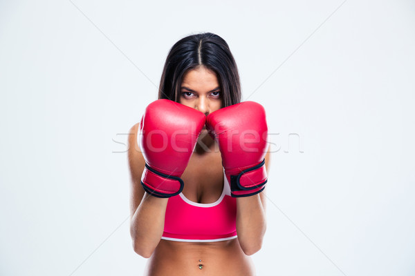 Sporty woman in boxing gloves Stock photo © deandrobot
