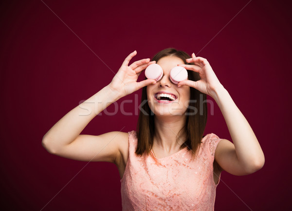 Happy woman closing her eyes with round cookies Stock photo © deandrobot