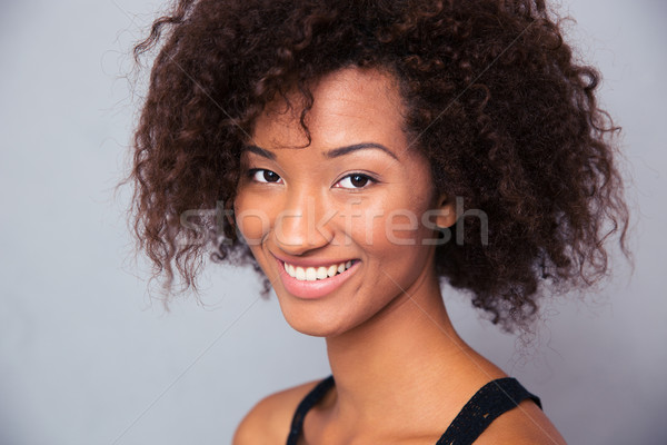 Portrait of a happy afro american woman  Stock photo © deandrobot