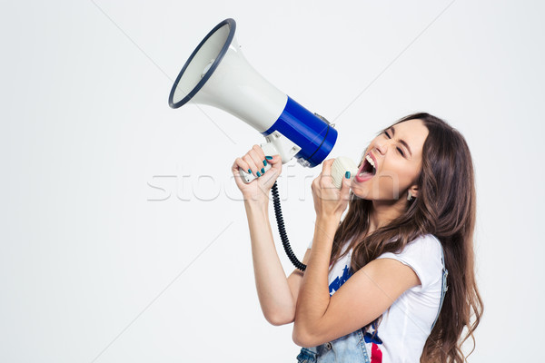 Woman screaming on loudspeaker  Stock photo © deandrobot