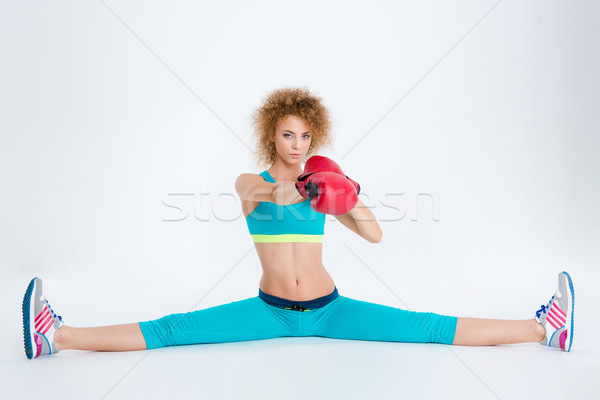 Woman doing twine and boxing in red gloves  Stock photo © deandrobot