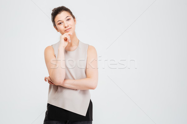 Dalgın çekici genç iş kadını ayakta düşünme Stok fotoğraf © deandrobot
