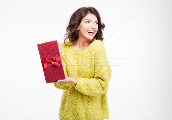 Cheerful woman holding gift box Stock photo © deandrobot