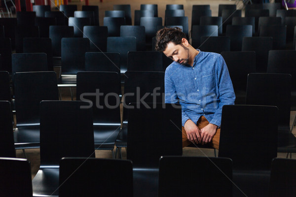 Man sleeping in conference hall Stock photo © deandrobot