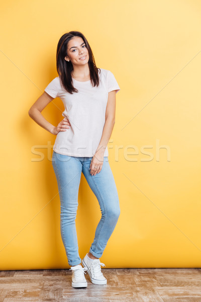 Full length portrait of a happy casual woman Stock photo © deandrobot