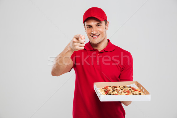 Image of pizza delivery man Stock photo © deandrobot