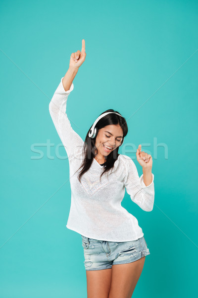 Boldog nyugodt nő fejhallgató tánc zenét hallgat Stock fotó © deandrobot