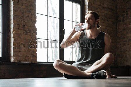 Portrait of a fitness man suffering from a leg pain Stock photo © deandrobot