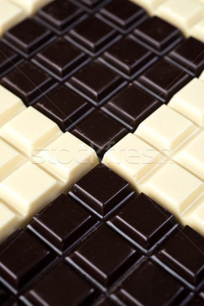 Stock photo: Dark and white chocolate bars combined together