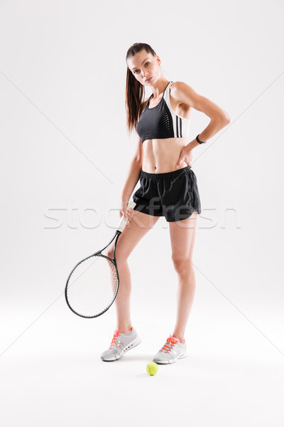 Full length portrait of a young slim woman in sportswear Stock photo © deandrobot
