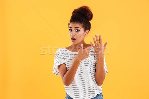 Displeased woman showing at her ring finger isolated Stock photo © deandrobot