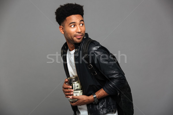 Portrait of a suspicious afro american man in leather jacket Stock photo © deandrobot