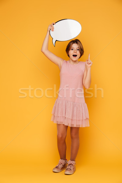 Full-length shot of happy confident girl holding bubble speech and have an idea Stock photo © deandrobot