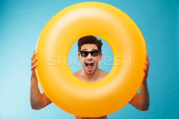 Close up of a cheerful man in sunglasses Stock photo © deandrobot