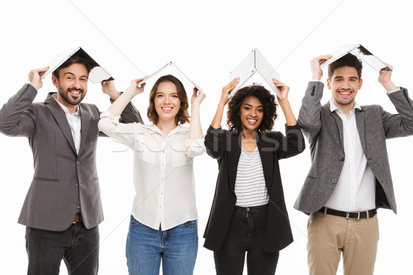 Portrait of a group of happy multiracial business people Stock photo © deandrobot