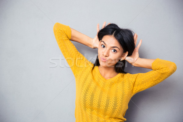 Woman making a funny face  Stock photo © deandrobot