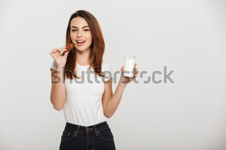 Cheerful lovely girl showing thumbs up Stock photo © deandrobot