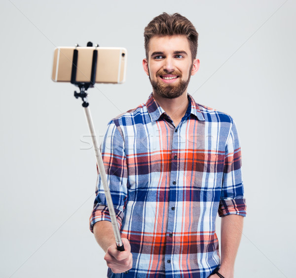 Stock photo: Happy man making selfie photo