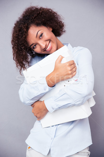 Stockfoto: Glimlachend · afro · amerikaanse · vrouw · permanente · mappen
