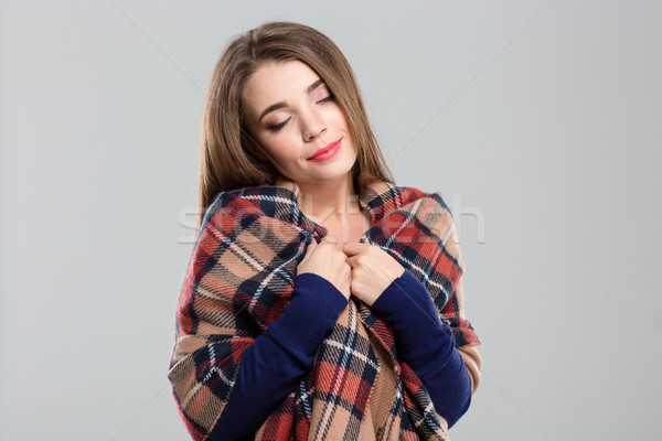 Beautiful woman with plaid and closed eyes  Stock photo © deandrobot